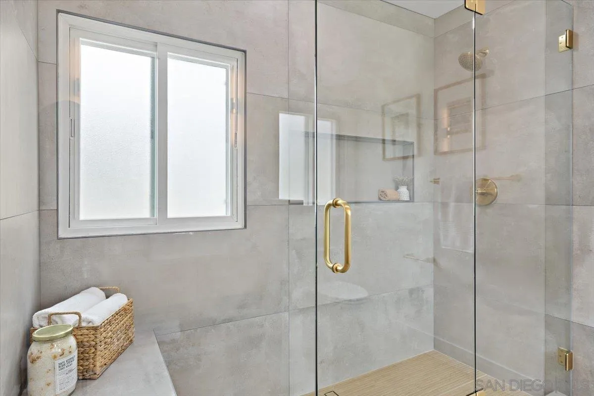 3663 Oleander Drive San Diego, CA 92106 - Photo 28 of 46 a bathroom with a bathtub and shower
