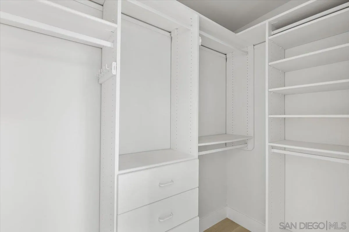 3663 Oleander Drive San Diego, CA 92106 - Photo 30 of 46 a view of walk in closet with empty racks