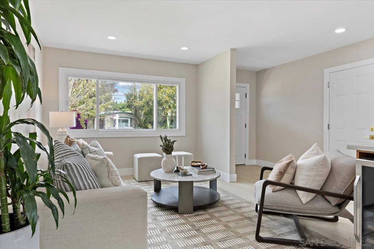 3663 Oleander Drive San Diego, CA 92106 - Photo 3 of 46 a living room with furniture and floor to ceiling windows