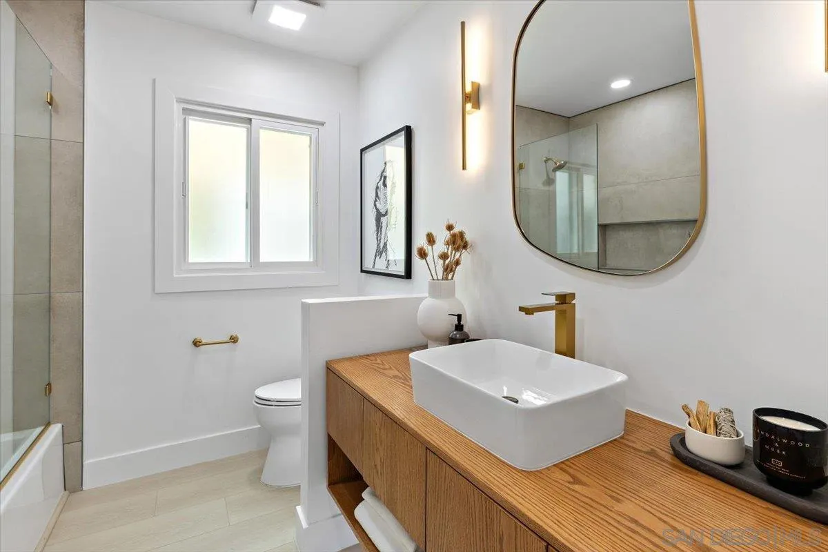 3663 Oleander Drive San Diego, CA 92106 - Photo 33 of 46 a bathroom with a sink and a mirror