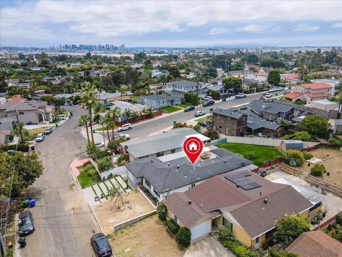 3663 Oleander Drive San Diego, CA 92106 - Photo 41 of 46 an aerial view of a swimming pool and mountain view in back
