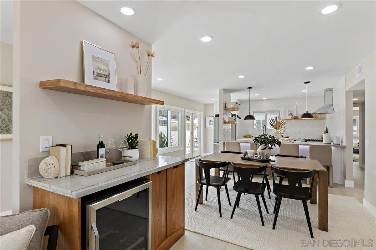 3663 Oleander Drive San Diego, CA 92106 - Photo 6 of 46 a kitchen with a table and chairs in it