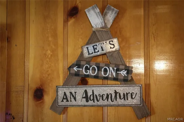 a bedroom with a bed and a lamp with the window