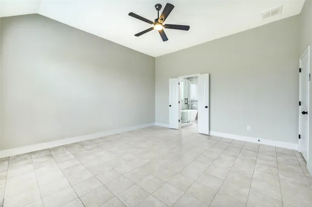 a bathroom with a double vanity sink a mirror and a bathtub
