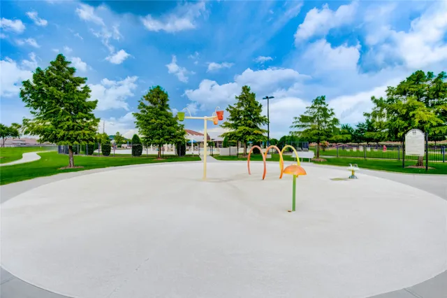 a view of a park with large trees