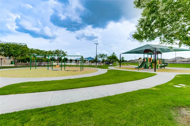 a view of a lake with houses in the back