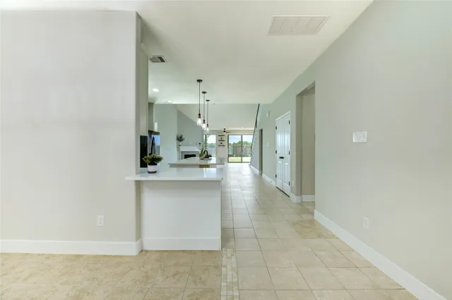 a large bathroom with a sink and a mirror