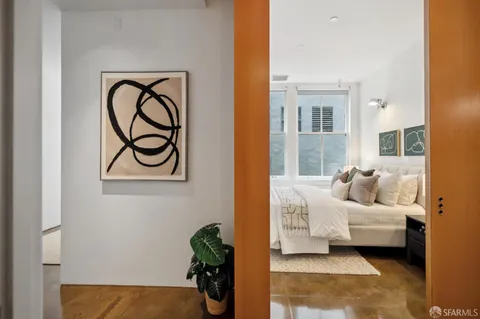 a bedroom with a bed and a couch