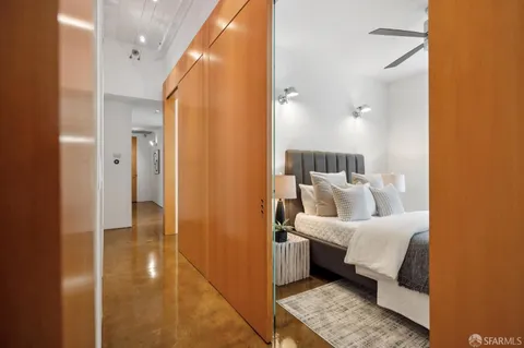 a bedroom with a bed and a couch