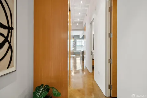 a view of a bathroom from a hallway