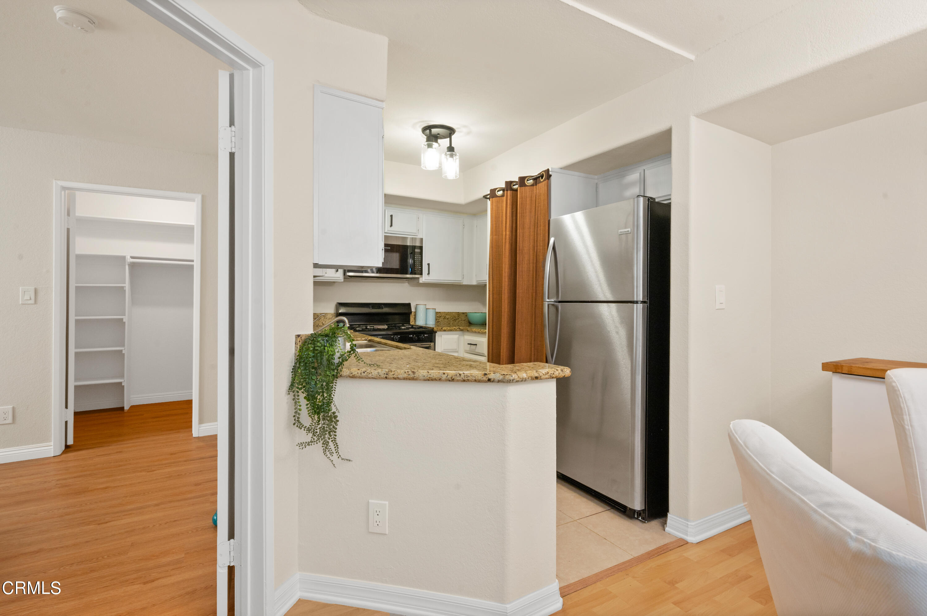 6140 Monterey Road, Unit 220 Los Angeles, CA 90042 - Photo 11 of 43 a kitchen with refrigerator and microwave