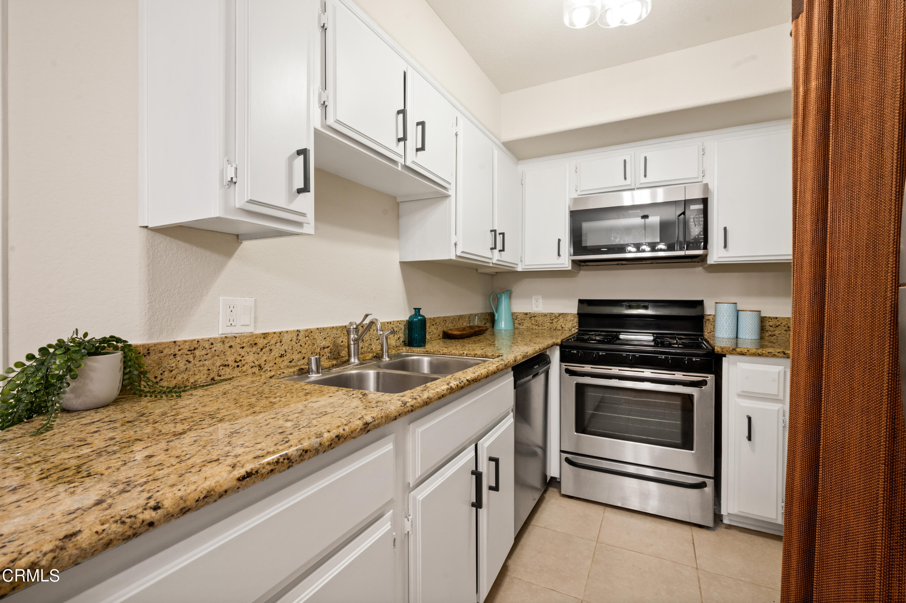 6140 Monterey Road, Unit 220 Los Angeles, CA 90042 - Photo 13 of 43 a kitchen with stainless steel appliances granite countertop a sink and a stove