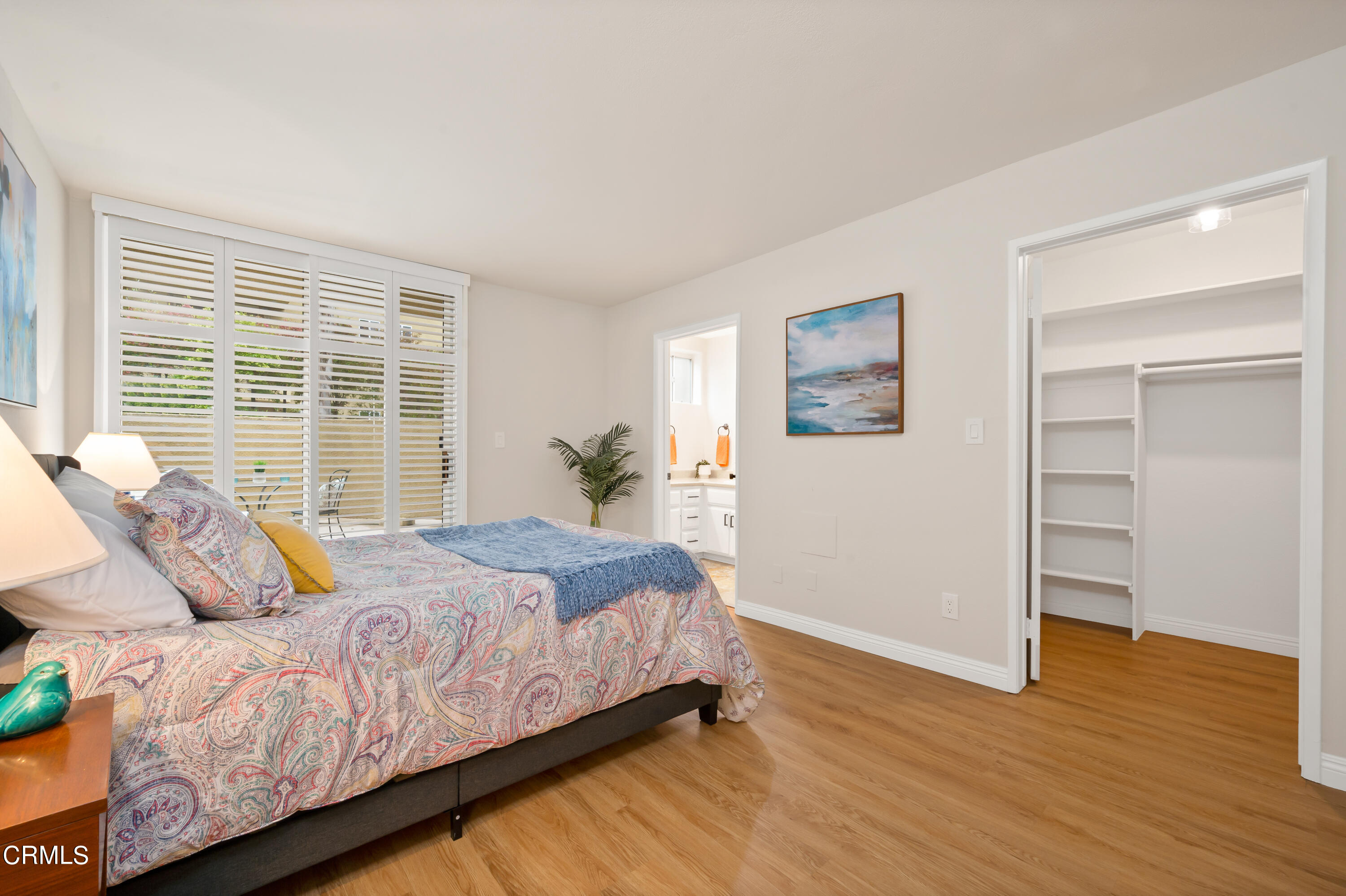 6140 Monterey Road, Unit 220 Los Angeles, CA 90042 - Photo 17 of 43 a bedroom with a bed and wooden floor