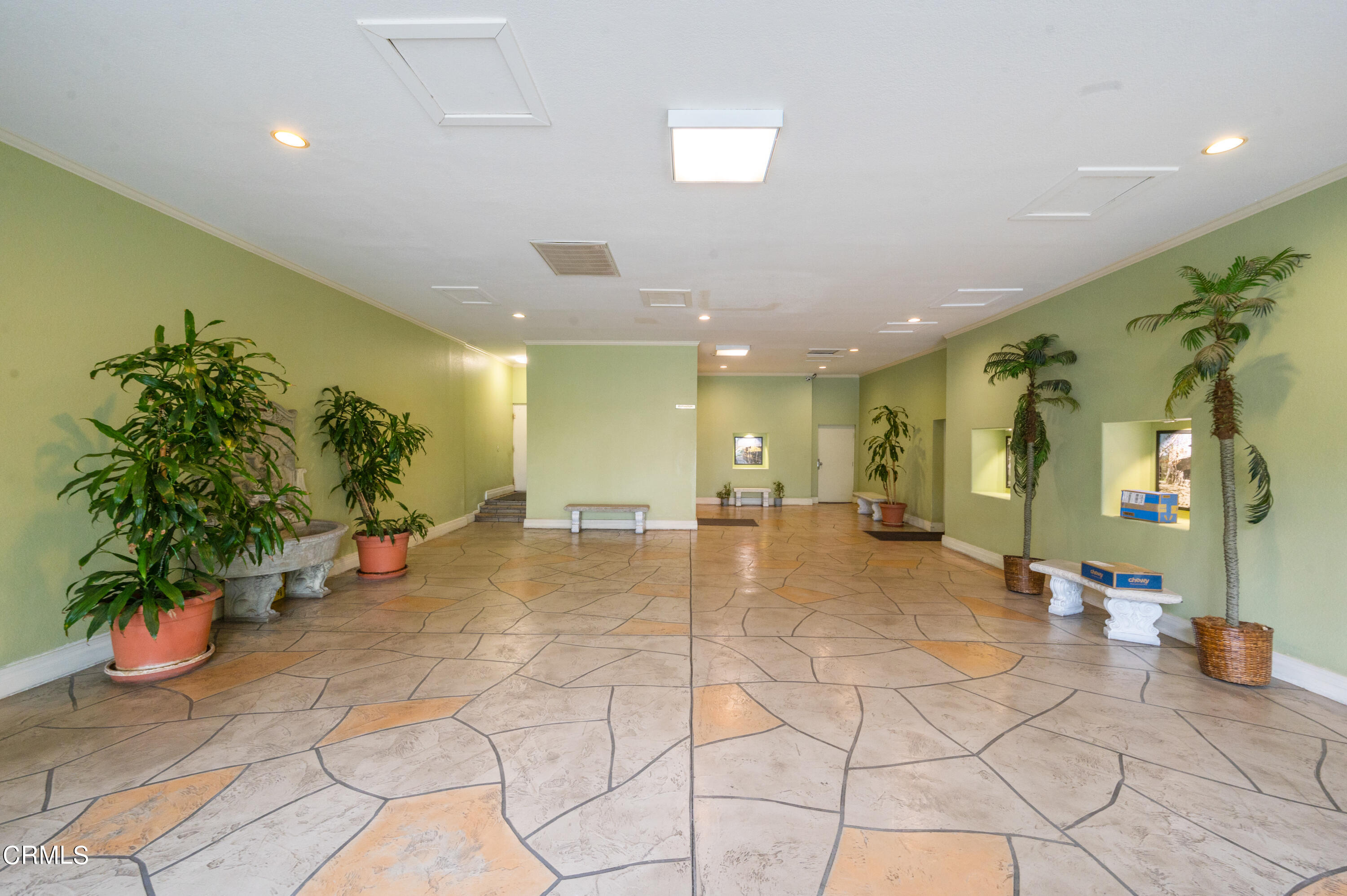 6140 Monterey Road, Unit 220 Los Angeles, CA 90042 - Photo 2 of 43 a lobby with furniture and potted plants