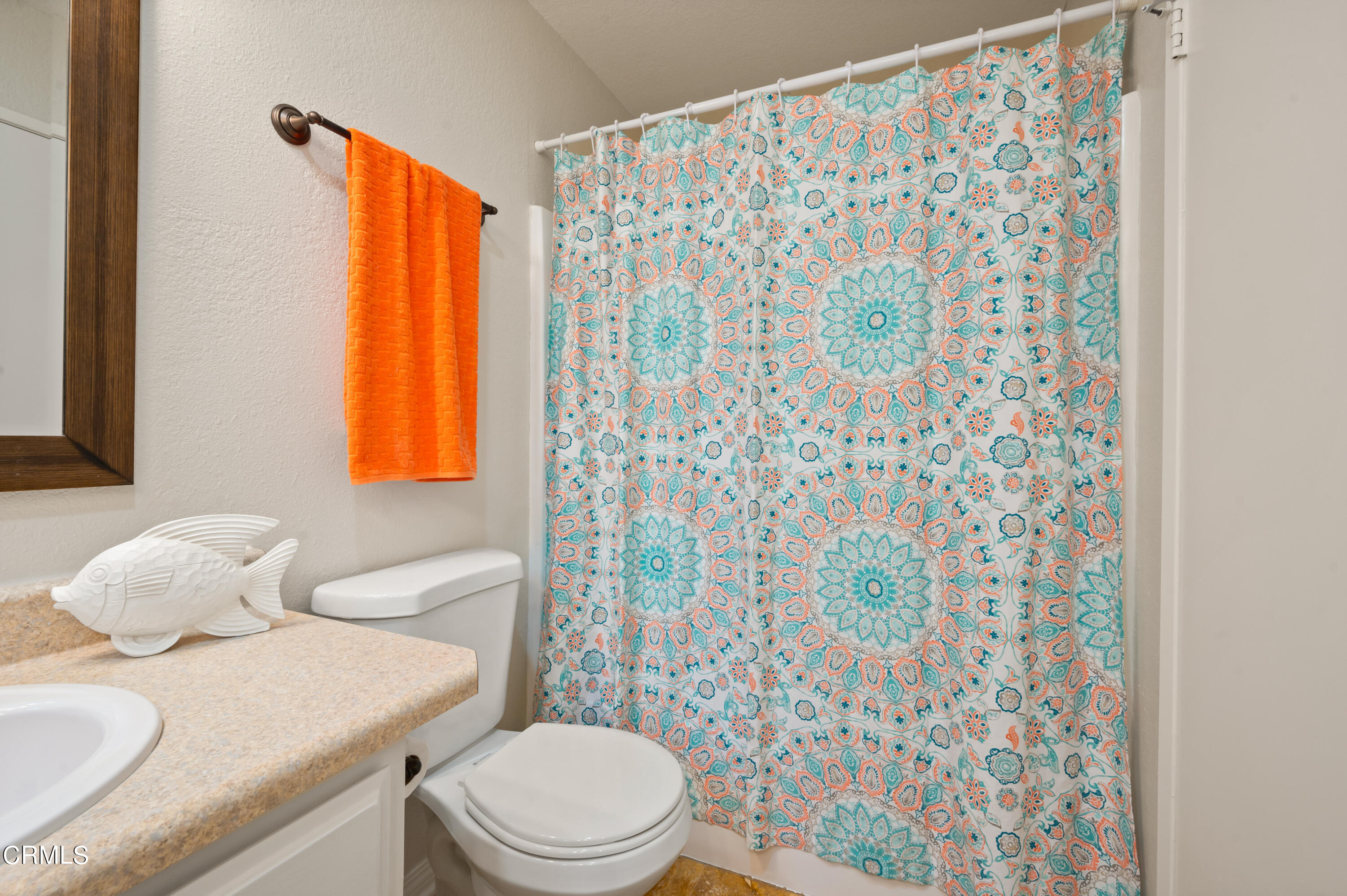 6140 Monterey Road, Unit 220 Los Angeles, CA 90042 - Photo 21 of 43 a bathroom with a sink toilet and shower curtain