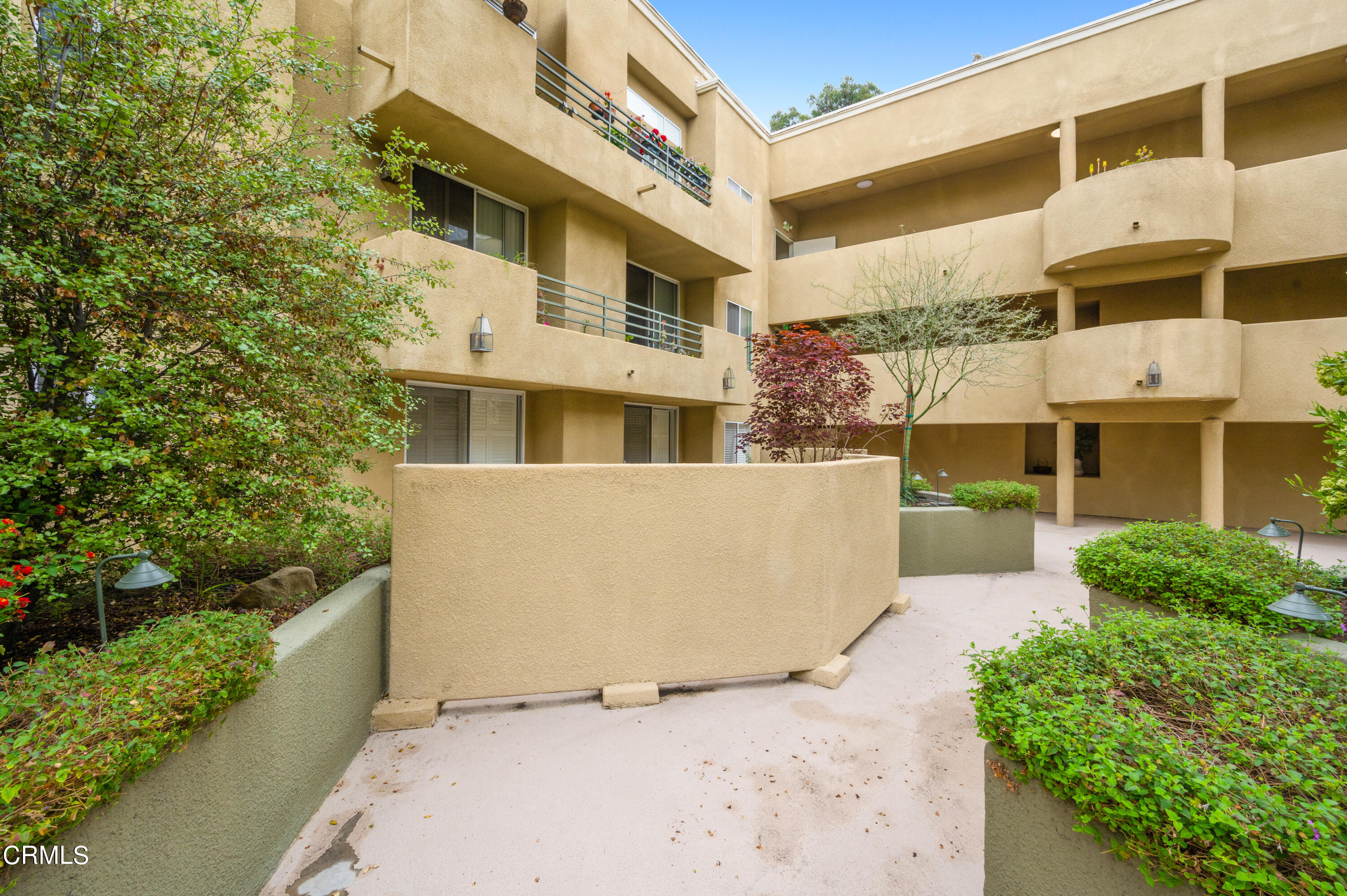 6140 Monterey Road, Unit 220 Los Angeles, CA 90042 - Photo 35 of 43 a front view of a building with a garden