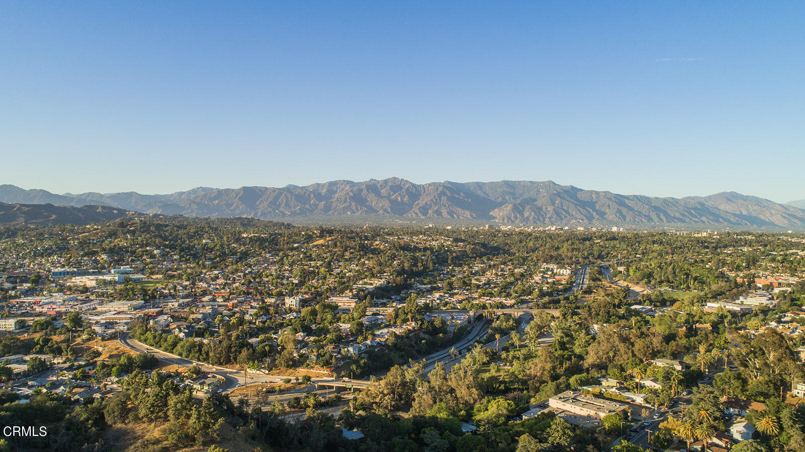 6140 Monterey Road, Unit 220 Los Angeles, CA 90042 - Photo 41 of 43 a view of a lush green field with mountains in the background