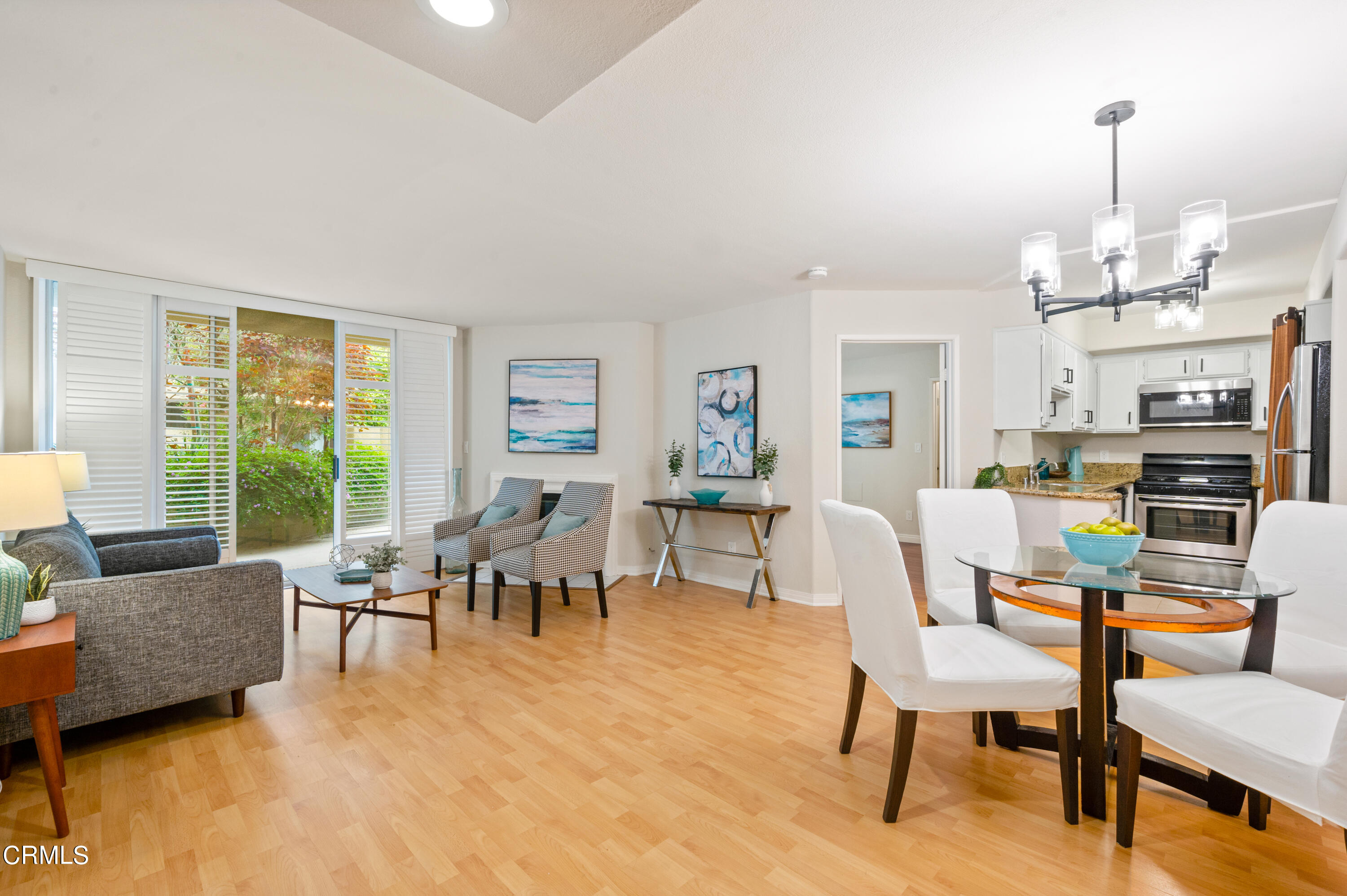6140 Monterey Road, Unit 220 Los Angeles, CA 90042 - Photo 5 of 43 a living room with lots of furniture and a chandelier