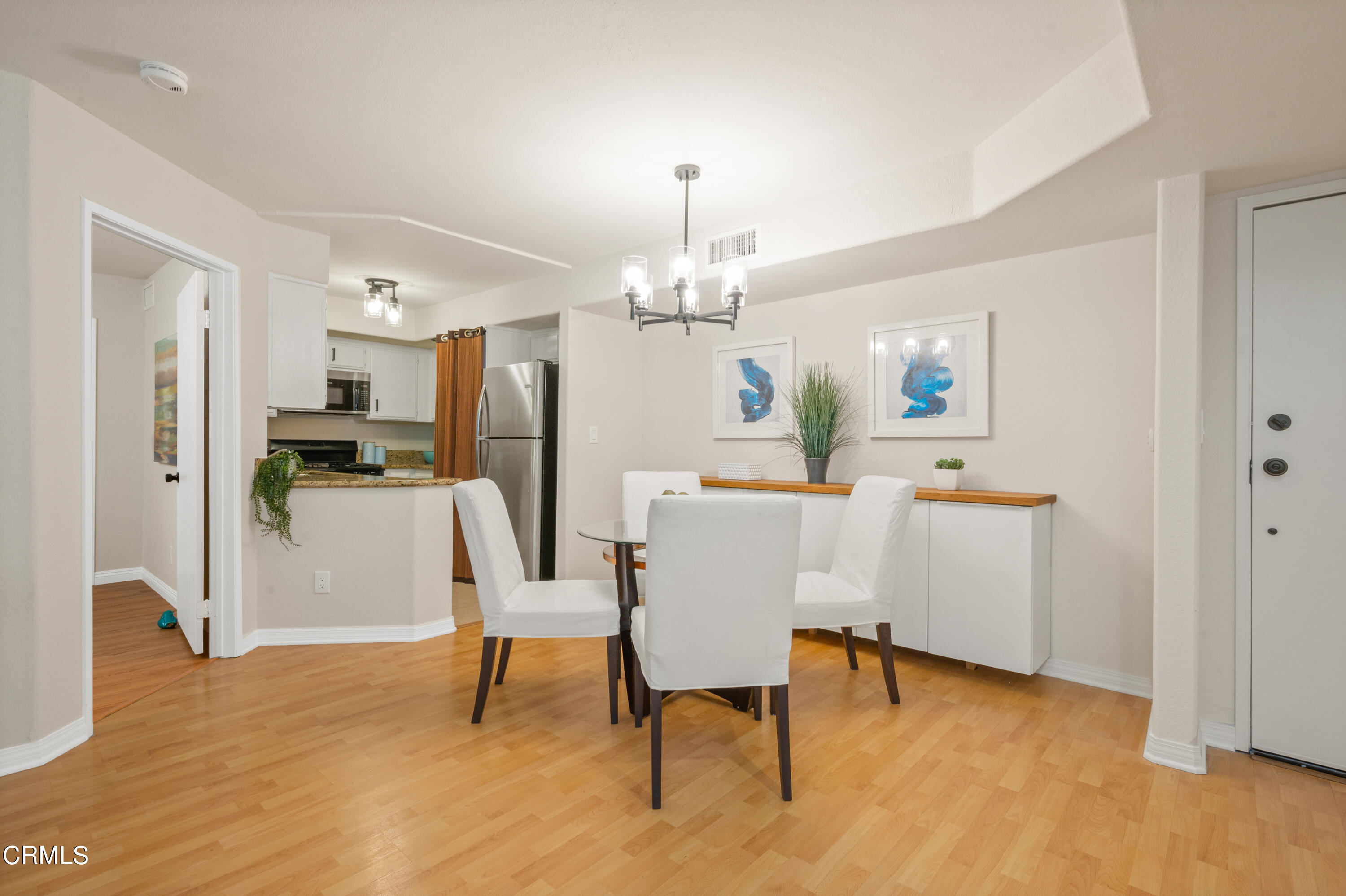 6140 Monterey Road, Unit 220 Los Angeles, CA 90042 - Photo 9 of 43 a view of a dining room with furniture and chandelier