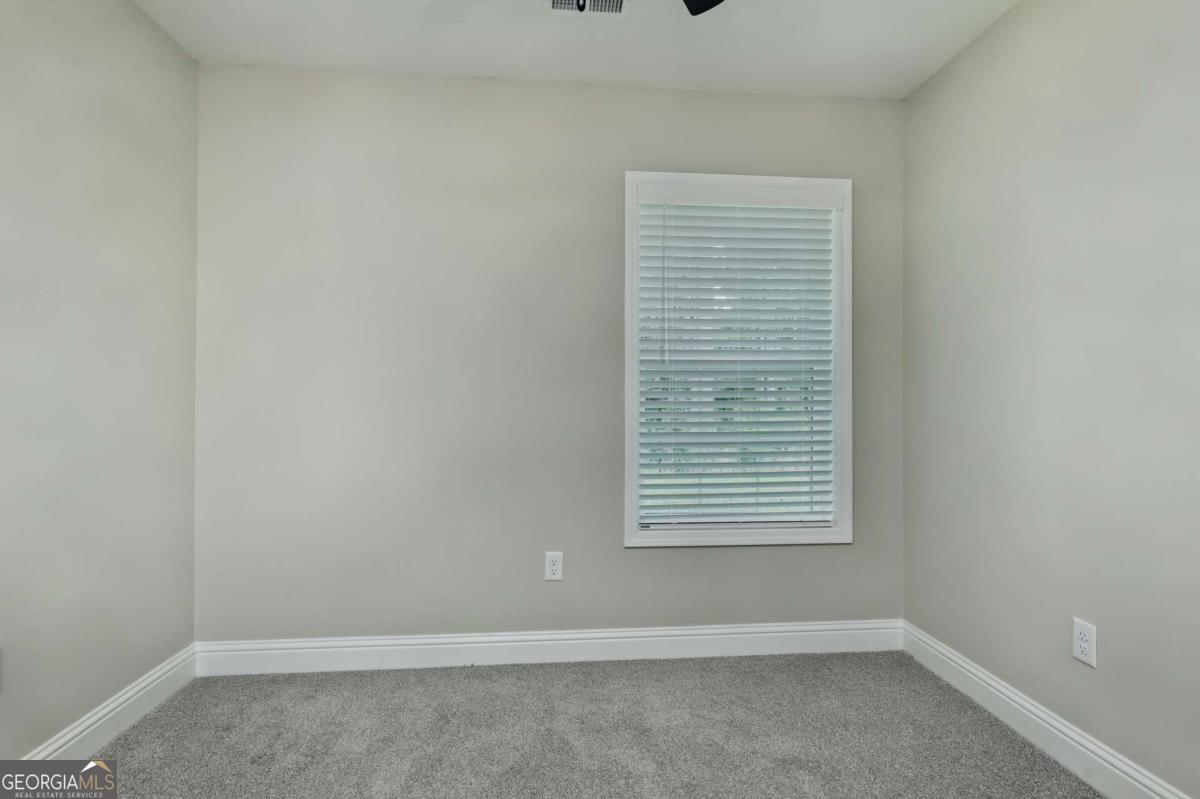 411 Madison Avenue St. Marys, GA 31558 - Photo 17 of 41 an empty room with a window