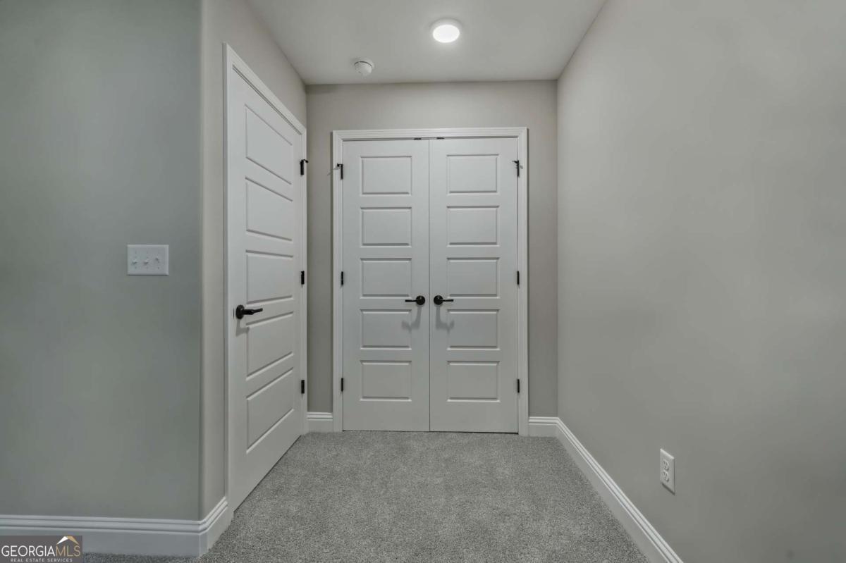 411 Madison Avenue St. Marys, GA 31558 - Photo 18 of 41 Loft Entry into Primary Suite/ Bedroom Three (upstairs)