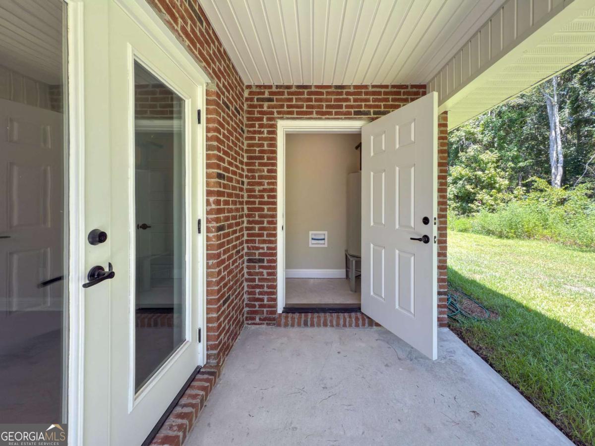411 Madison Avenue St. Marys, GA 31558 - Photo 26 of 41 a view of a porch of the house