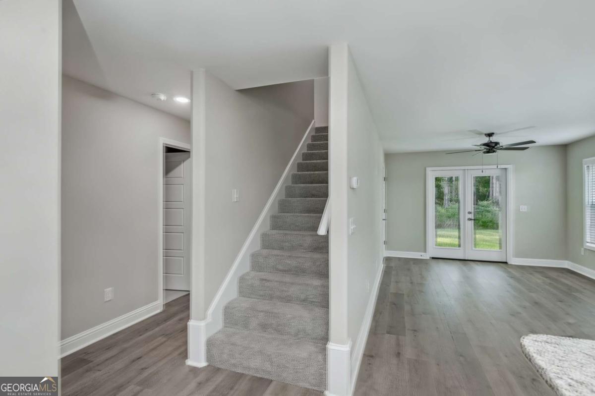 411 Madison Avenue St. Marys, GA 31558 - Photo 3 of 41 a view of an entryway with wooden floor and stairs