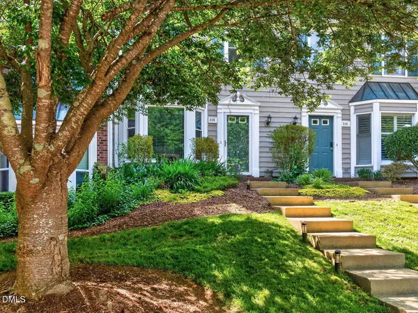 front view of a house with a yard