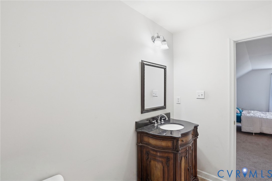 5305 Wellington Ridge Road Richmond, VA 23231 - Photo 50 of 67 Ornate wood vanity with an integral white sink and