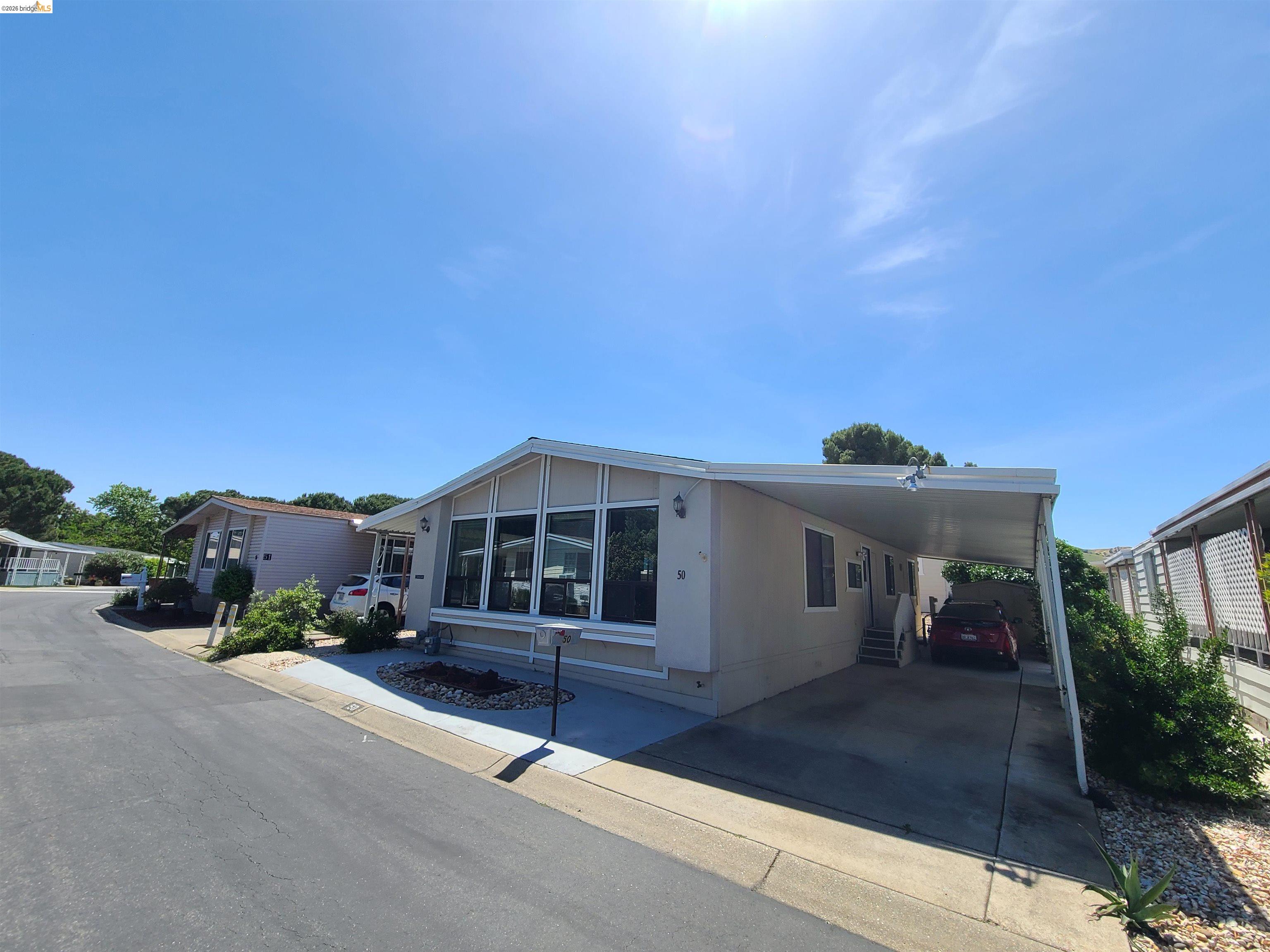 50 Leo Lane, Unit 50 Antioch, CA 94509 - Photo 1 of 64 a front view of a house with a yard