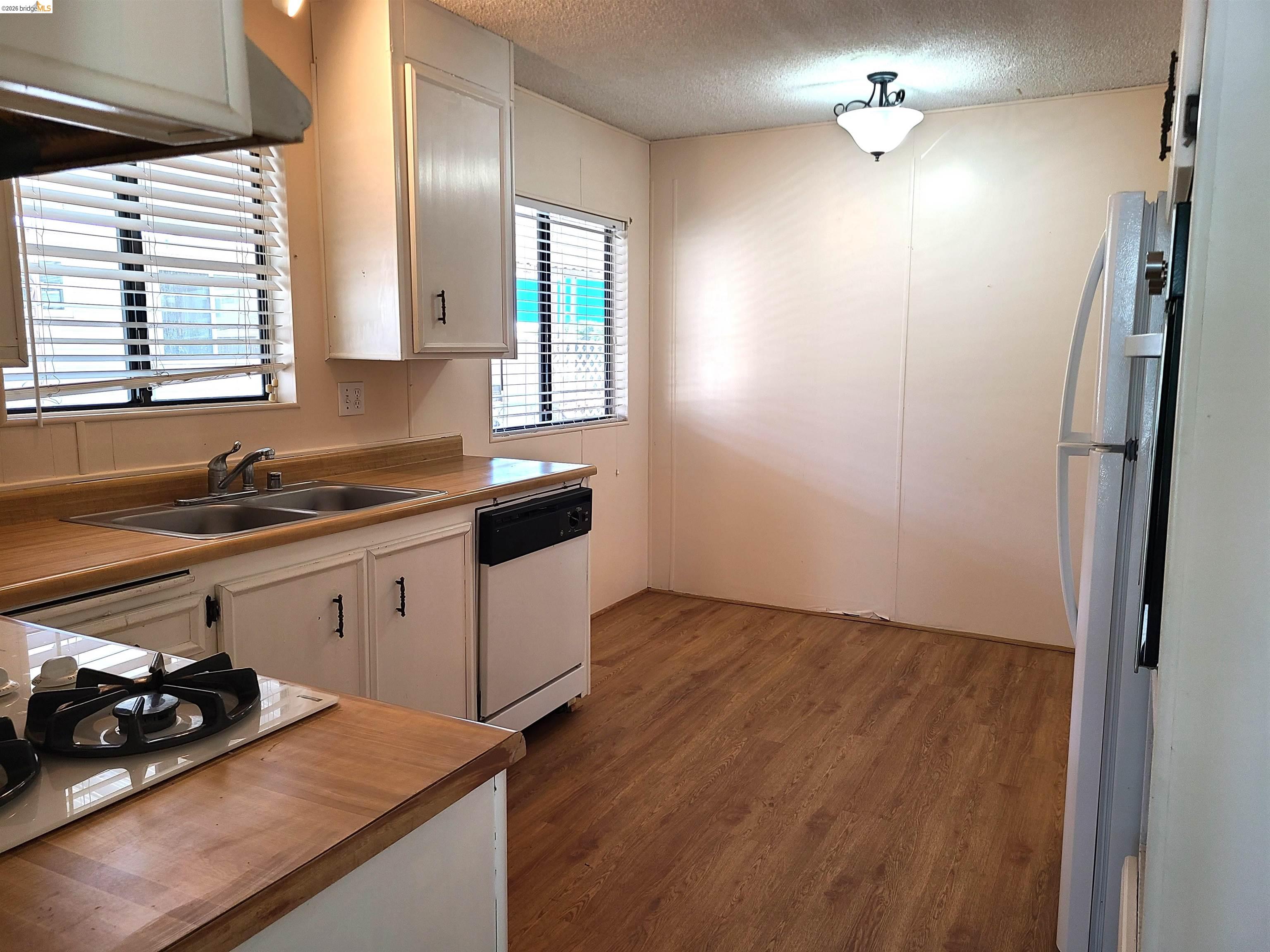 50 Leo Lane, Unit 50 Antioch, CA 94509 - Photo 16 of 64 a kitchen with sink cabinets and window