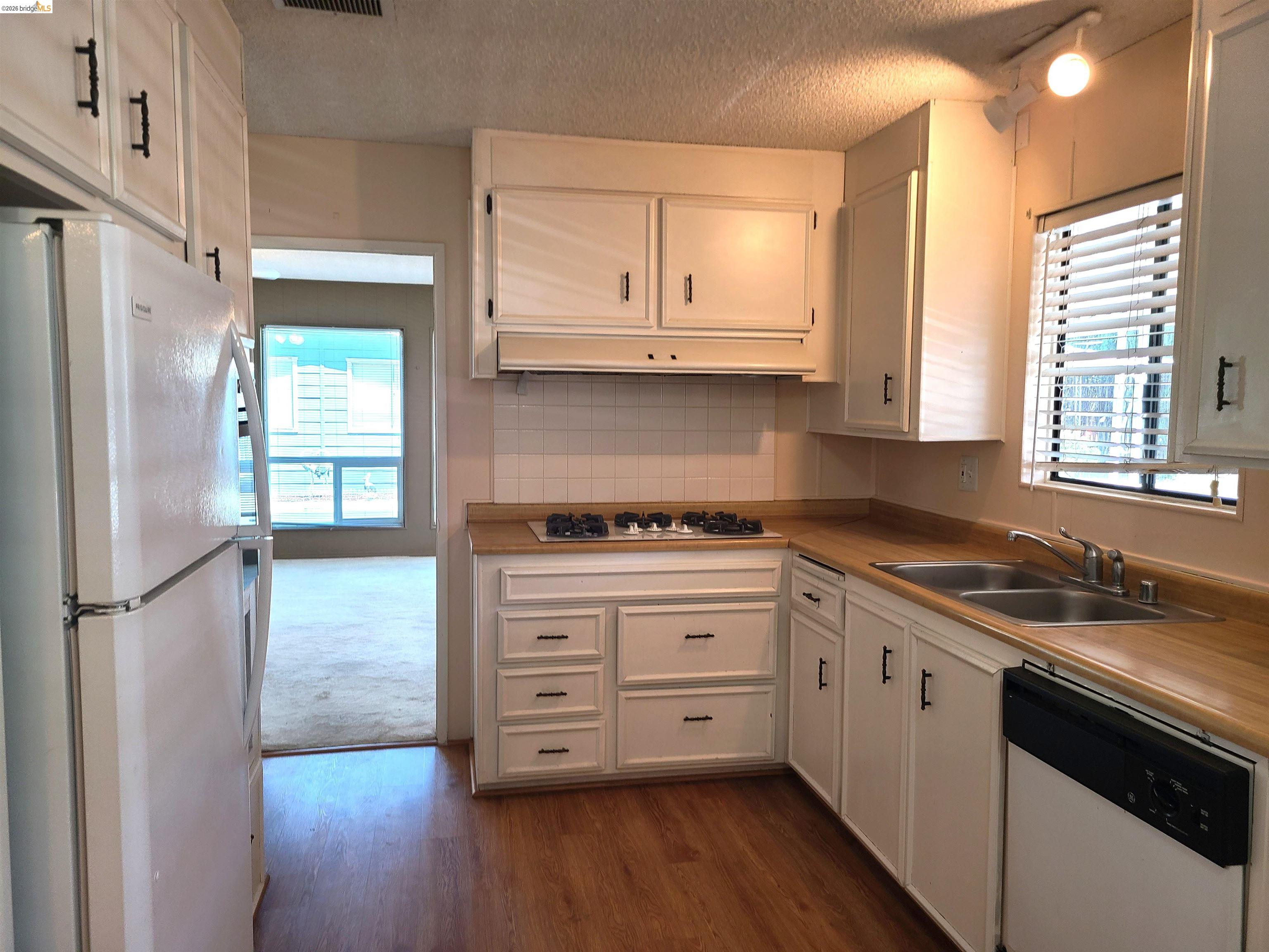 50 Leo Lane, Unit 50 Antioch, CA 94509 - Photo 20 of 64 a kitchen with stainless steel appliances granite countertop a refrigerator sink and cabinets