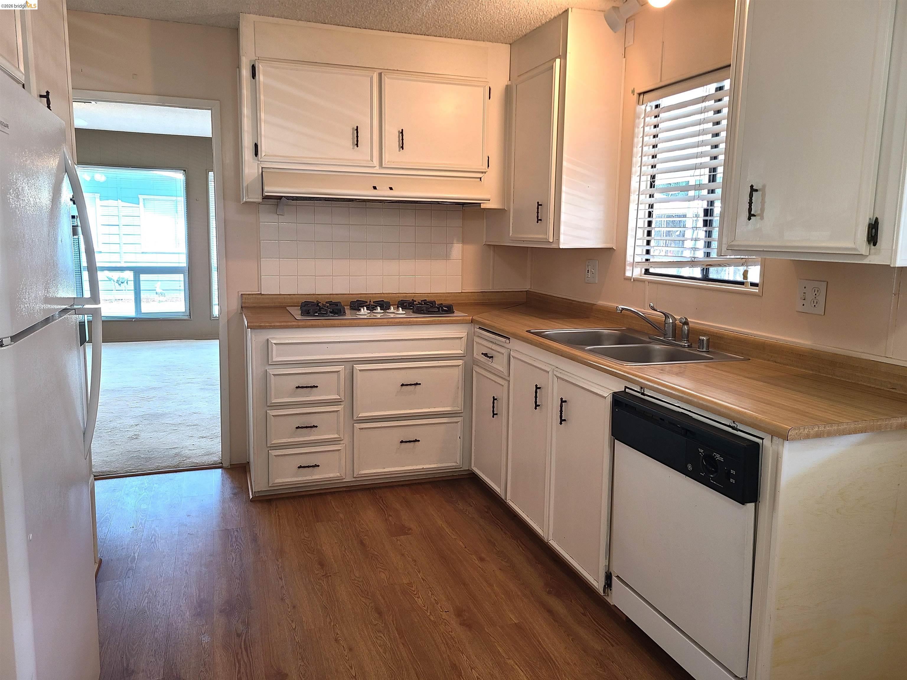 50 Leo Lane, Unit 50 Antioch, CA 94509 - Photo 21 of 64 a kitchen with stainless steel appliances a stove a sink and a microwave