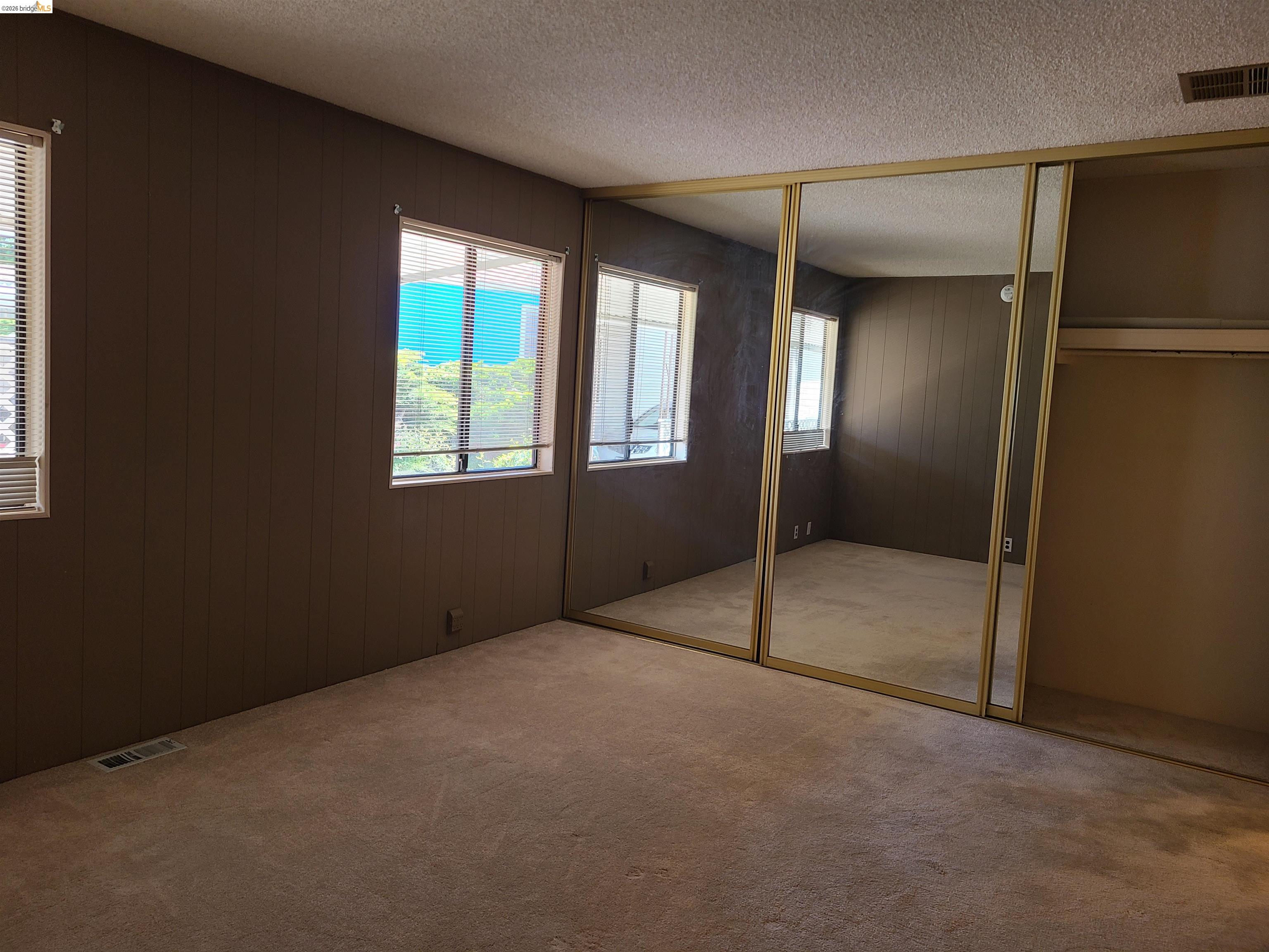 50 Leo Lane, Unit 50 Antioch, CA 94509 - Photo 26 of 64 an empty room with windows and closet