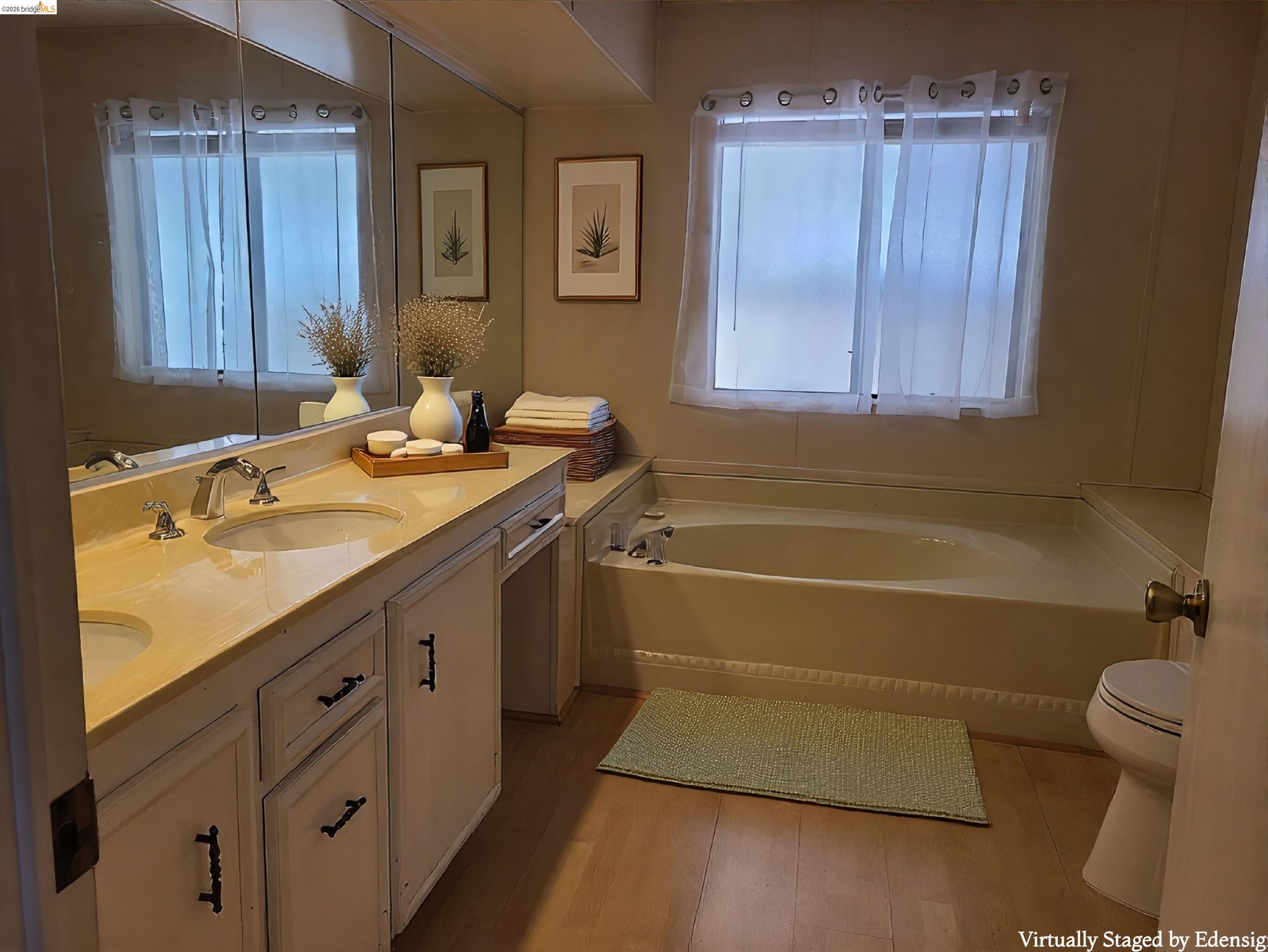 50 Leo Lane, Unit 50 Antioch, CA 94509 - Photo 27 of 64 a bathroom with a granite countertop sink a toilet and bathtub