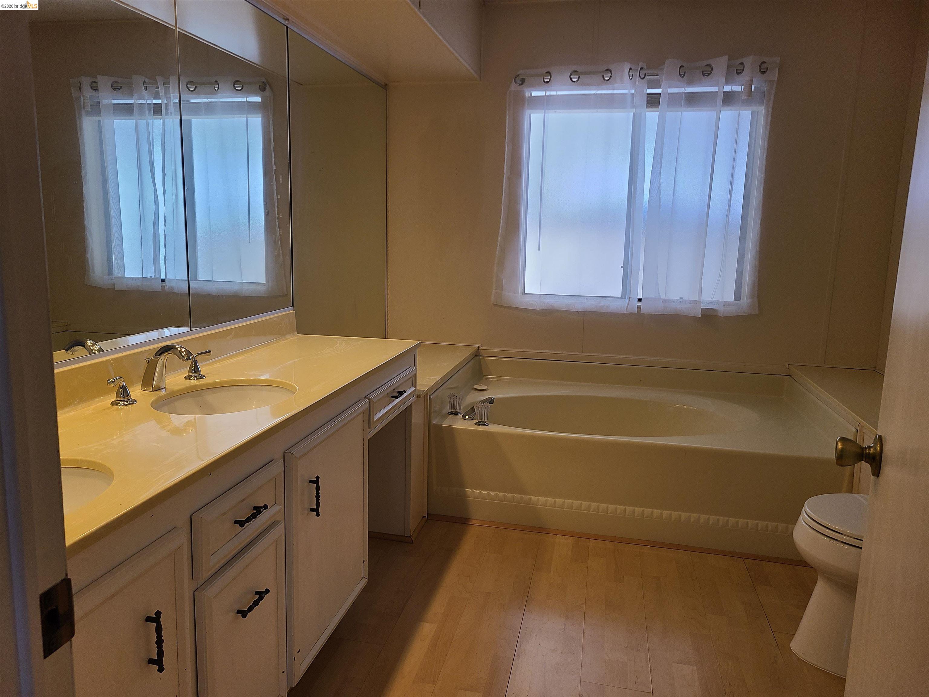 50 Leo Lane, Unit 50 Antioch, CA 94509 - Photo 28 of 64 a bathroom with a granite countertop sink a toilet and bathtub