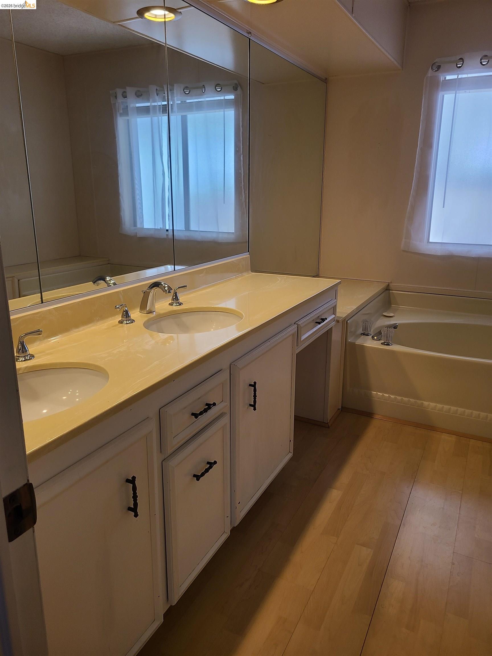 50 Leo Lane, Unit 50 Antioch, CA 94509 - Photo 30 of 64 a bathroom with a granite countertop sink and a bathtub