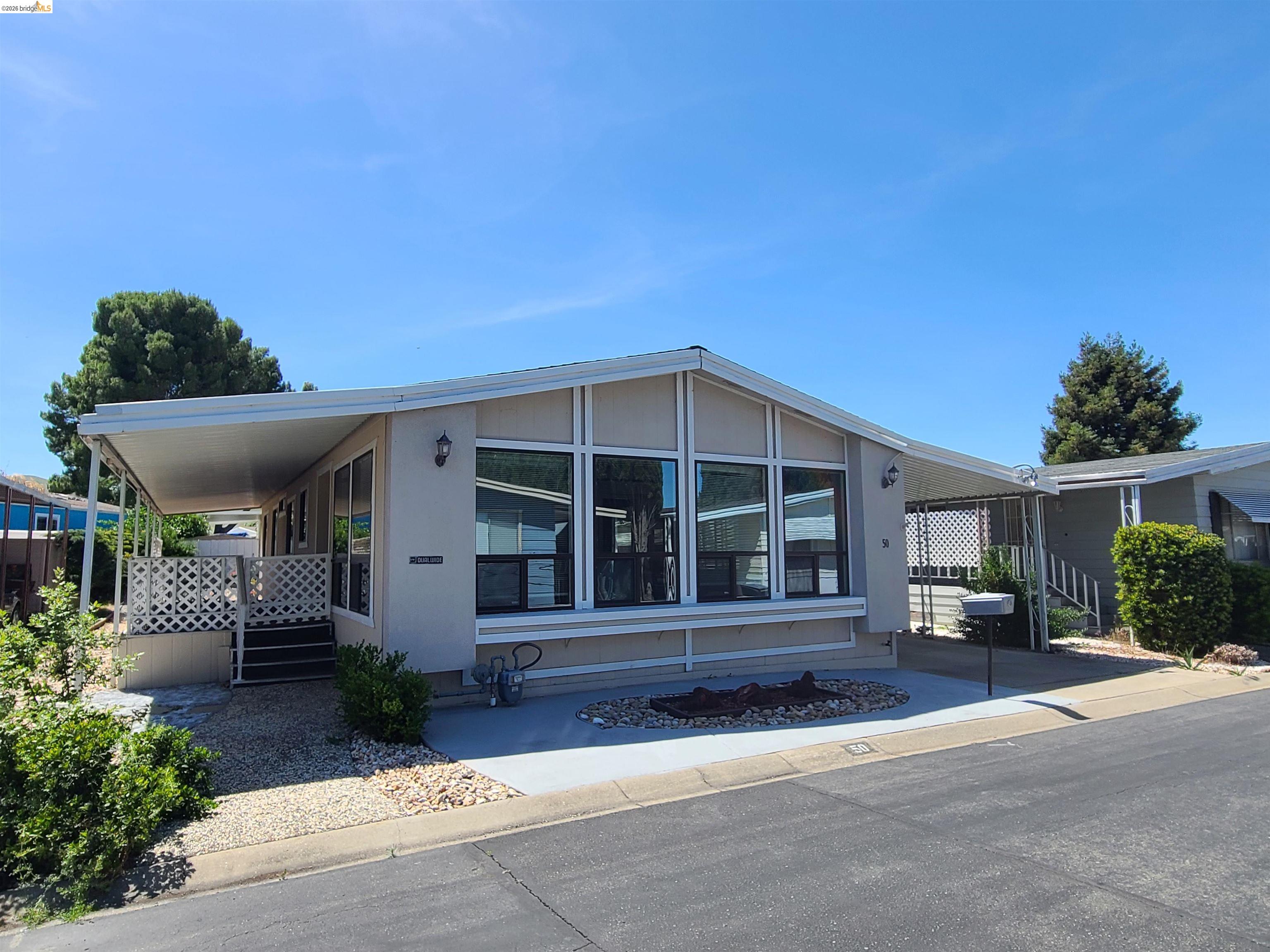 50 Leo Lane, Unit 50 Antioch, CA 94509 - Photo 3 of 64 front view of a house with a yard