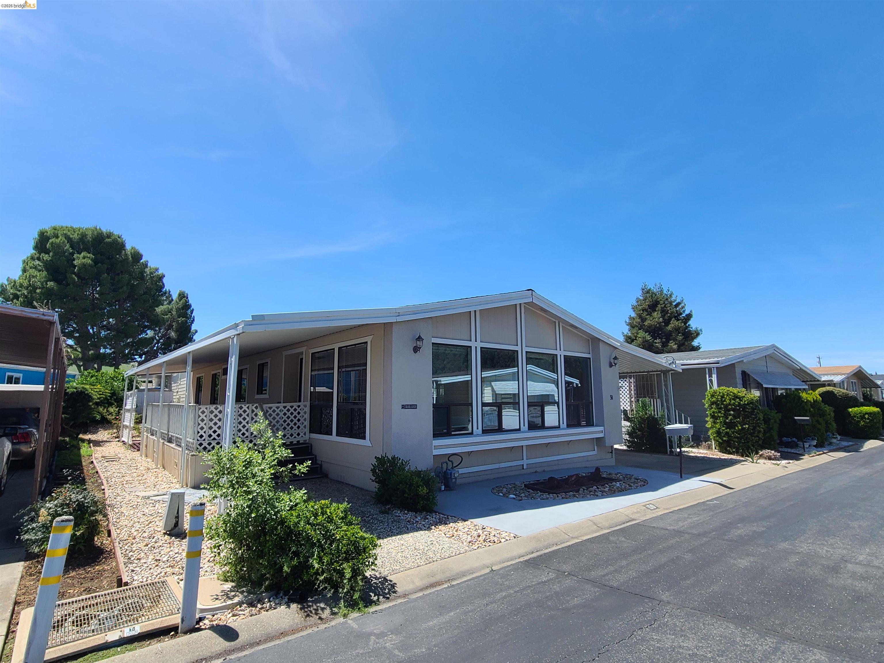 50 Leo Lane, Unit 50 Antioch, CA 94509 - Photo 4 of 64 a front view of a house with a yard
