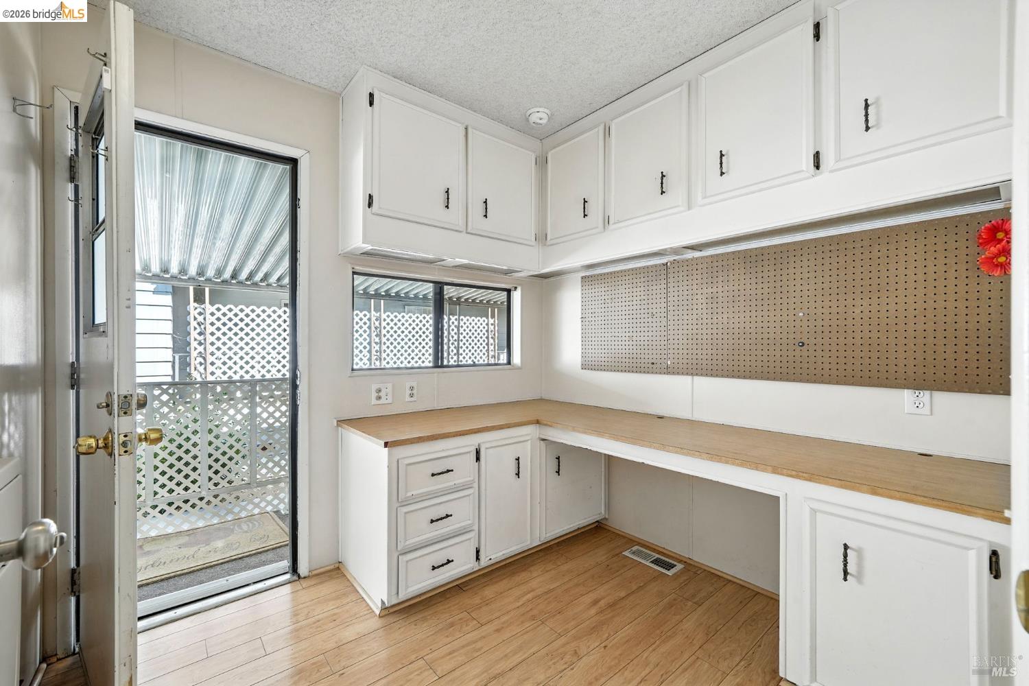 50 Leo Lane, Unit 50 Antioch, CA 94509 - Photo 42 of 64 a kitchen with white cabinets and window