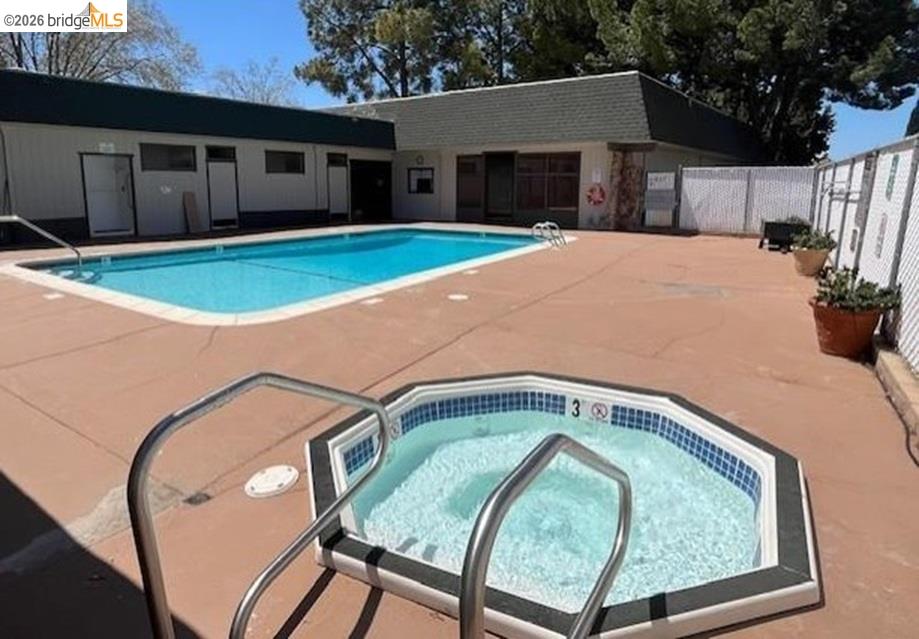 50 Leo Lane, Unit 50 Antioch, CA 94509 - Photo 54 of 64 a backyard of a house with yard and garage