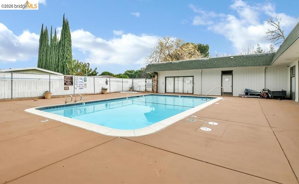 50 Leo Lane, Unit 50 Antioch, CA 94509 - Photo 56 of 64 a view of a house with a swimming pool and a yard
