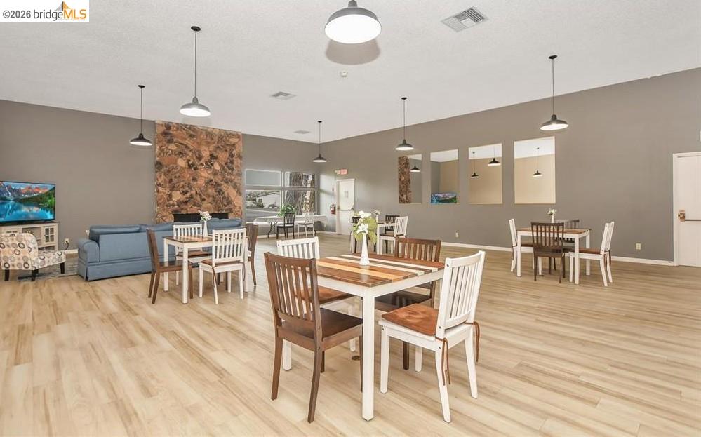 50 Leo Lane, Unit 50 Antioch, CA 94509 - Photo 59 of 64 a dining room with furniture and wooden floor