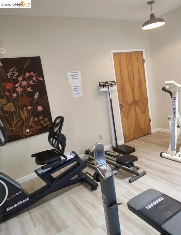 50 Leo Lane, Unit 50 Antioch, CA 94509 - Photo 63 of 64 a room with gym equipment and a mirror