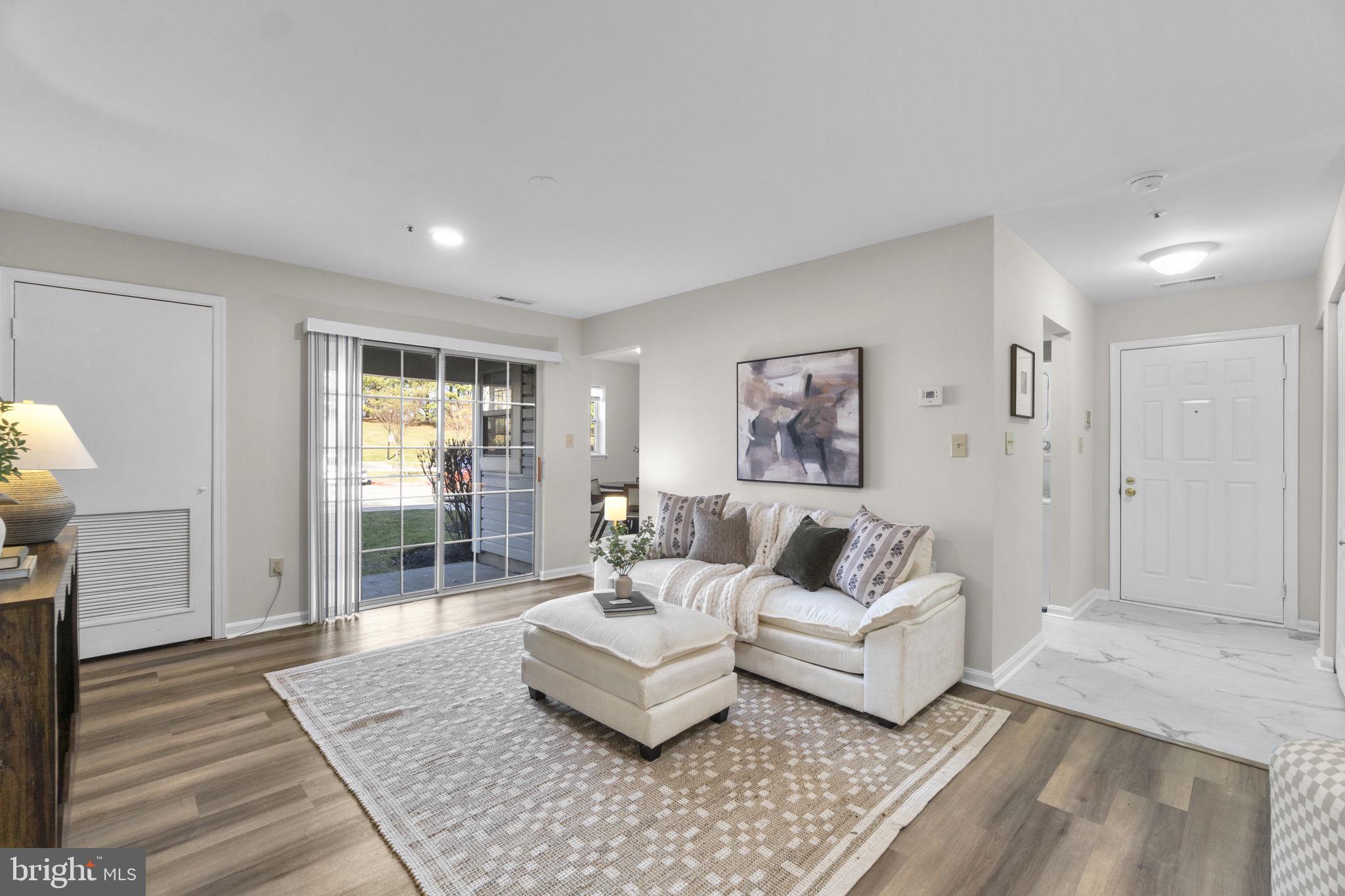8585 Falls Run Road, Unit D Ellicott City, MD 21043 - Photo 6 of 30 Living Room with Sliders to Patio