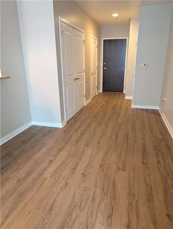 a bathroom with a granite countertop sink and a toilet
