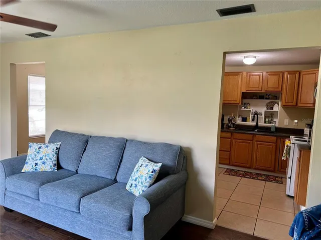 a living room with furniture and a rug
