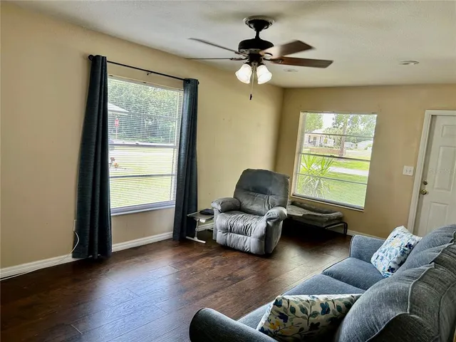 a living room with furniture and a window