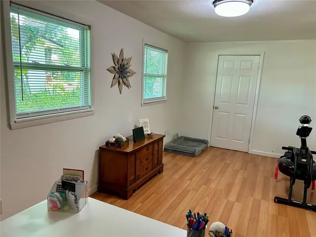 a bed room with furniture and a window