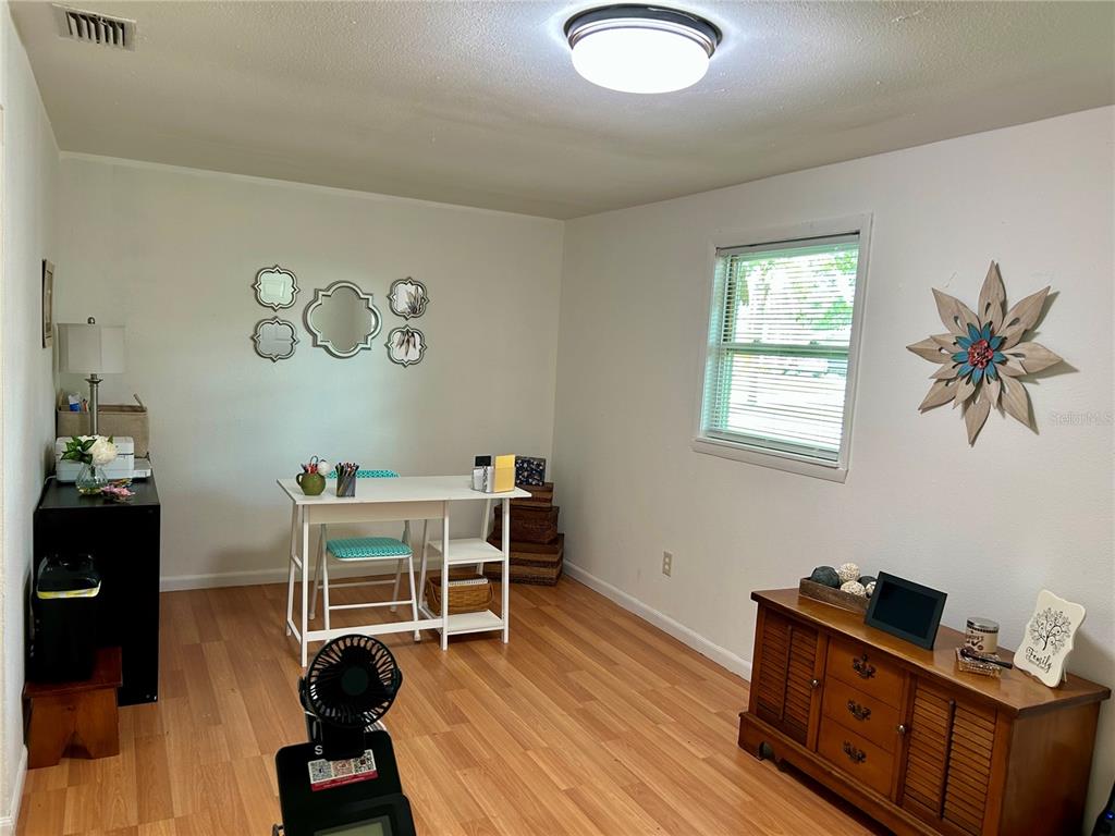 304 Bell Street Wauchula, FL 33873 - Photo 24 of 41 a view of a workspace with furniture and a window